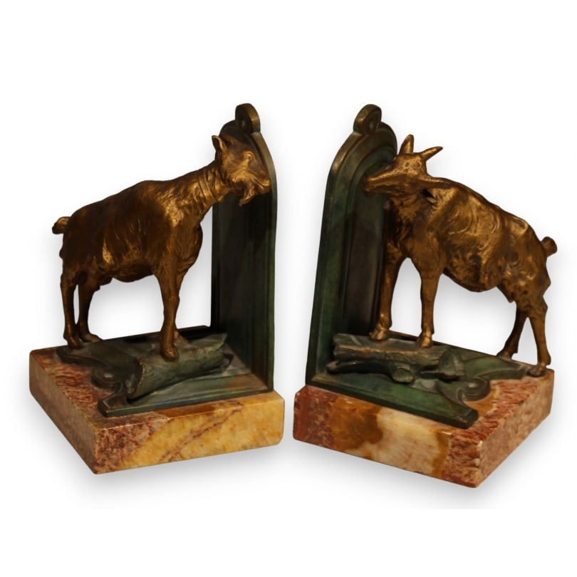 Pair of "Goat" bookends signed FERRAND: Pair of "Goat" bookends in green and gold spelter, signed FERRAND (Ernest Justin 1846-1932), on a beige marble baseOrigin: FrancePeriod: Early 20th centuryMaterials: SpelterDimensions: Ht 16 x 10 x 10