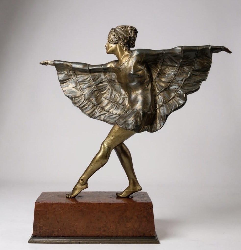 Art Deco Bouraine - Bronze sculpture of a dancer in a butterfly dress: Art Deco patinated bronze sculpture depicting a dancer in a butterfly dress and a scarab necklace, created by Marcel André Bouraine, circa 1925. The sculpture rests on a wood and bronze base, unsigne