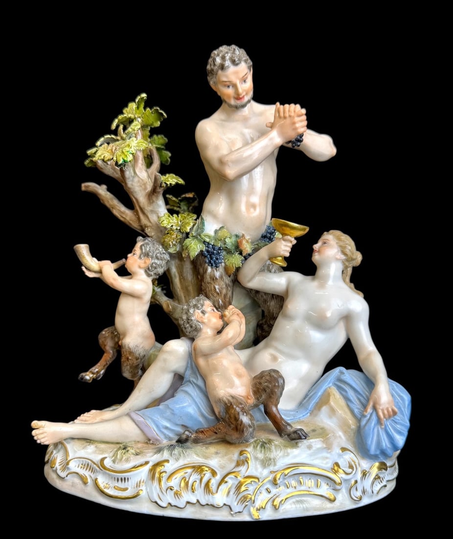 19th century Meissen - Group of Bacchantes: Meissen porcelain group "Bacchantes" (Satyrgruppe). Model created by Johann Carl Schönheit circa 1770-1772. The four figures are finely detailed: the satyr presses grapes to pour wine for the nymph,