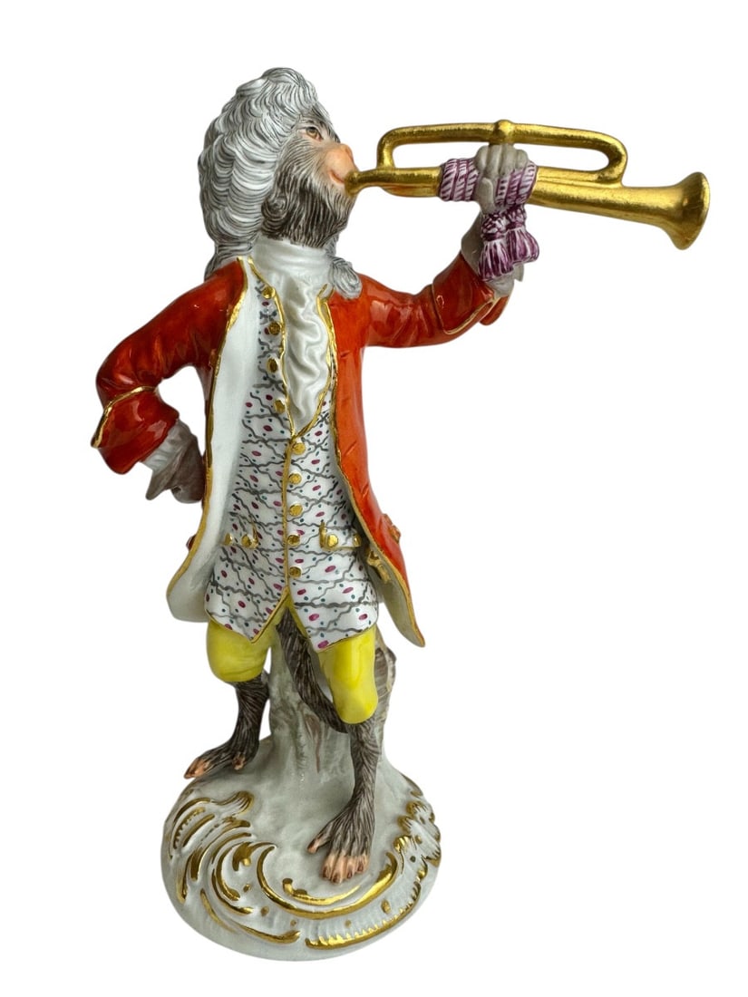 Meissen - Porcelain figure of a trumpet-playing monkey from the series "The Monkey Orchestra": Meissen porcelain figurine of a trumpeter monkey (Affe als Trompeter). Model created by Johann Joachim Kaendler in 1753 and revised in 1765 with Peter Reinicke. Marked with blue crossed swords and num