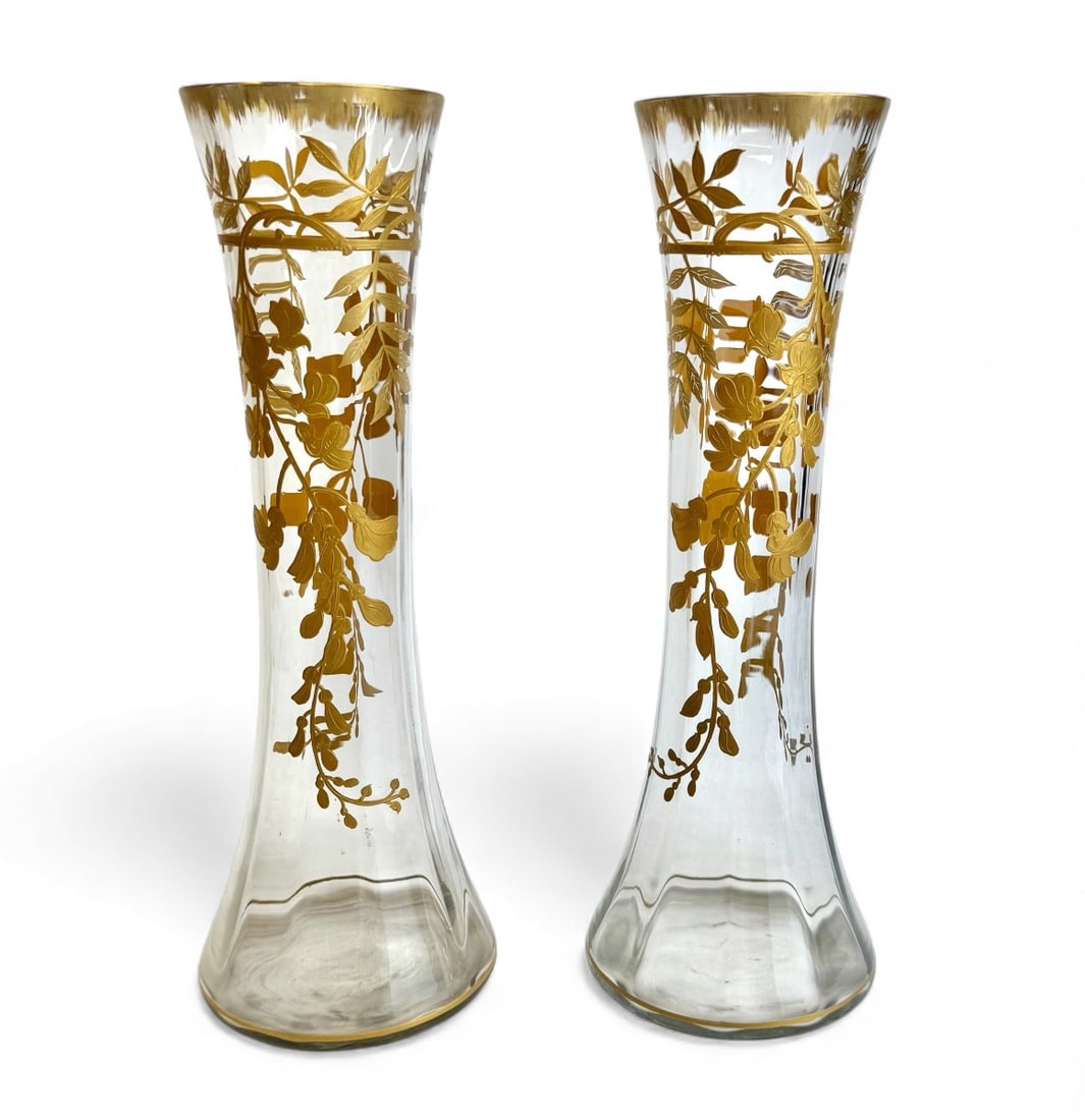 19th century Baccarat - pair of vases decorated with wisteria: A pair of Baccarat Art Nouveau cylindrical clear vases with Venetian ribbing and a gold enamel decoration of wisteria branches in relief. The ends are highlighted with fine gold.A similar model is lis