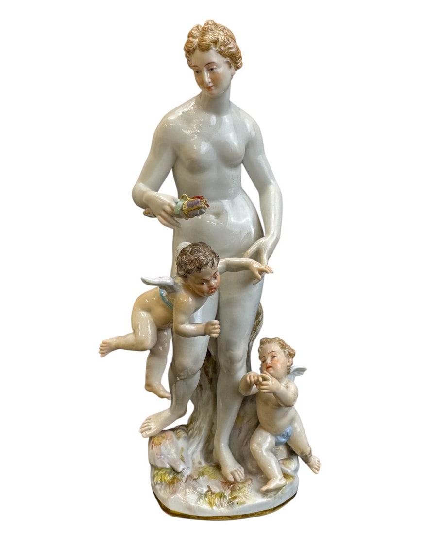 Meissen - Porcelain group of Venus with Cupids: Meissen porcelain group from the Mythology series, entitled Venus with Cupids (Venus mit Amoretten). The group depicts Venus, the Roman goddess of love and beauty, flanked by two cupids. Model created