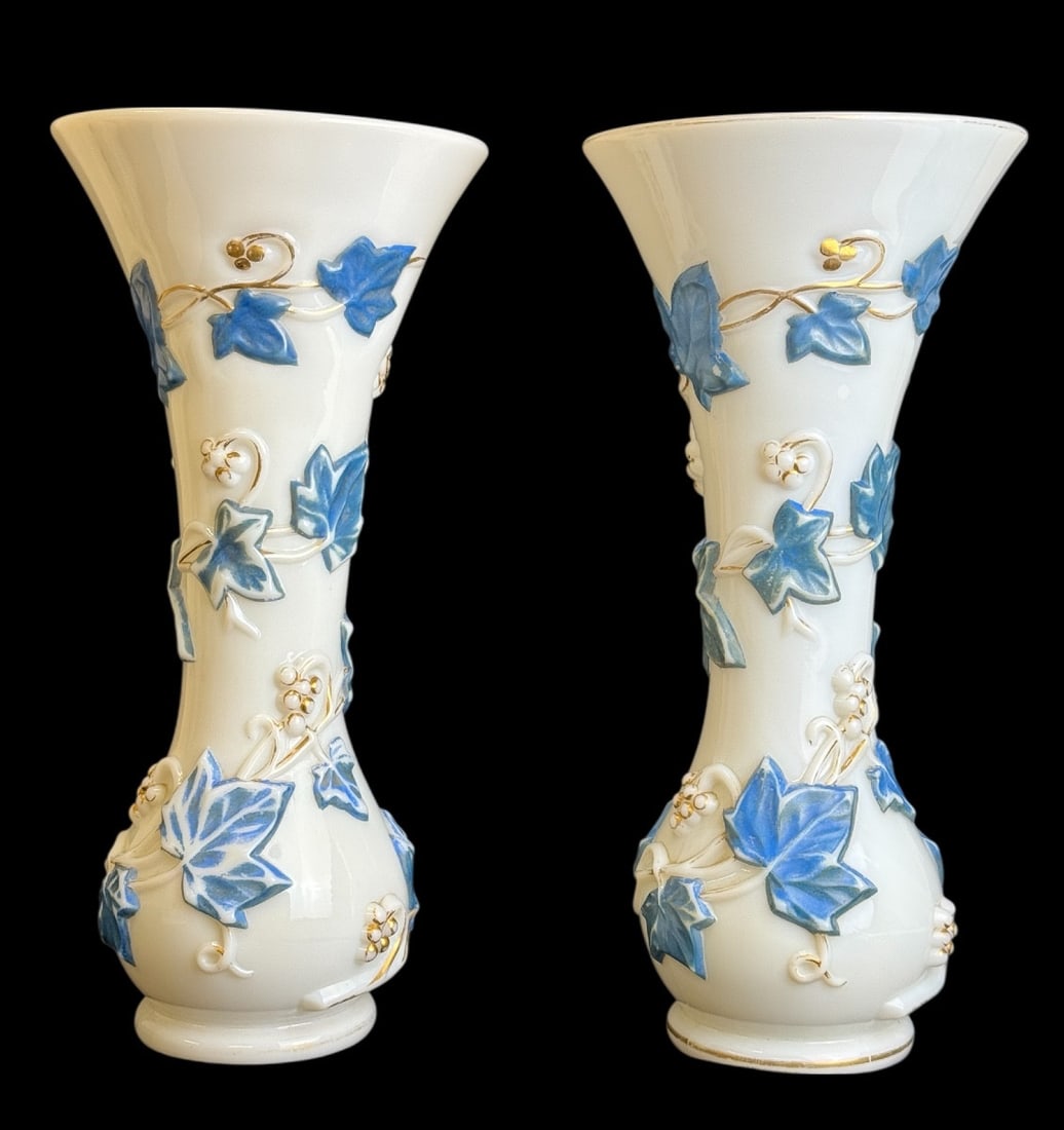 Baccarat - Pair of molded opaline vases with ivy garland.: "Baccarat - Pair of molded opaline vases with ivy garland decoration."Pair of molded opaline vases with a rotating decoration of ivy garlands painted in blue and gold. In perfect condition, only some