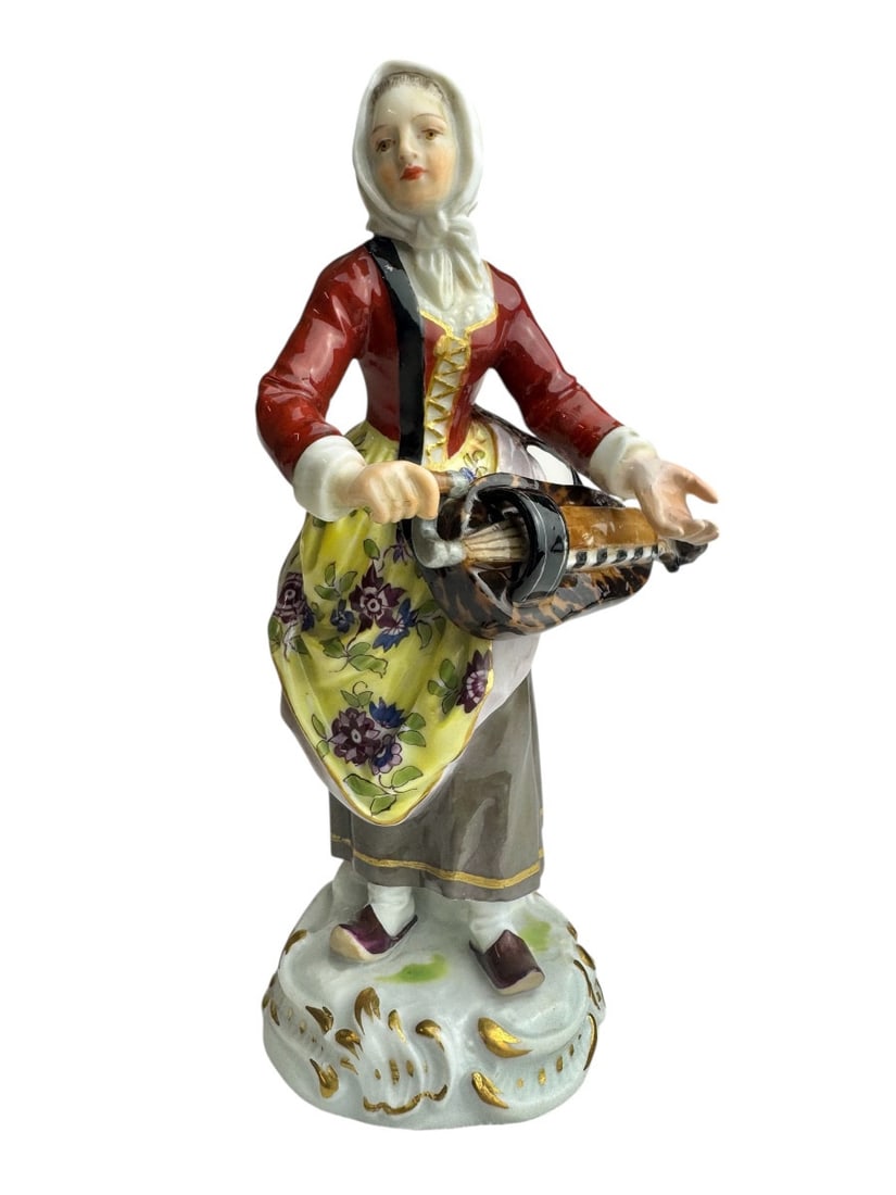 Meissen - The Cries of Paris, Girl with the Lyre.: Meissen porcelain figurine from the "Cries of Paris" series, girl with a lyre (Mädchen mit Leier). Model created by Peter Reinicke around 1753-1754. Marked with blue crossed swords and numbered 20, 1