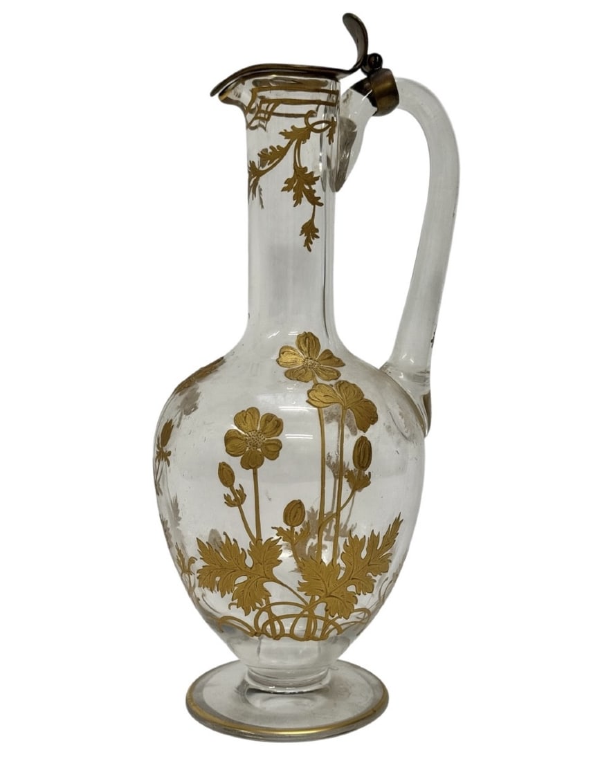 19th century Baccarat Art Nouveau Wine Decanter/Ewer: A Baccarat crystal wine decanter/ewer, gilt and enameled with a gold anemone flower design, bronze lid. Art Nouveau period, circa 1900. Height: 27 cm