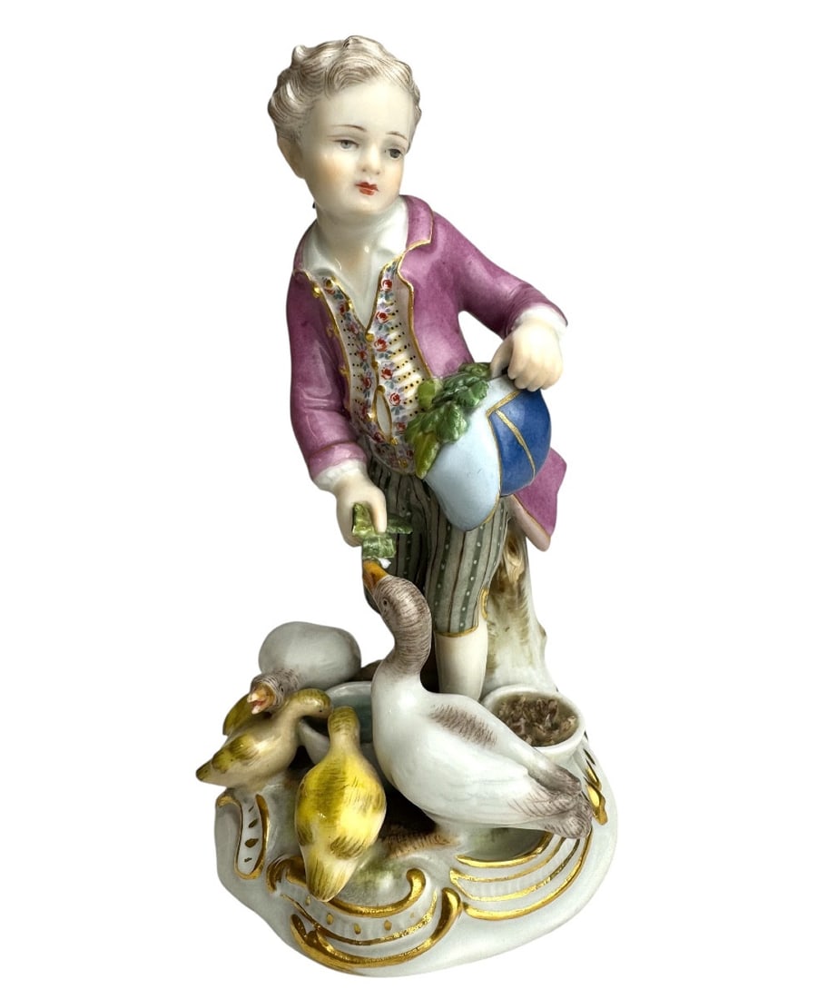 Meissen - Porcelain figurine of a boy feeding geese: Meissen porcelain figure of a boy feeding geese (Knabe, Gänse fütternd), created by Johann Joachim Kaendler around 1769. Blue sword mark and numbered C41, 19th century. Listed in the Meissen-Bergman