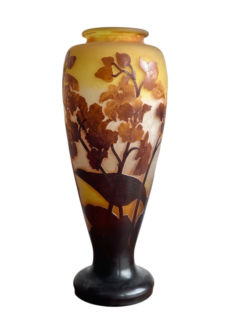 19th century Gallé, vase decorated with orchids: Baluster-shaped vase on a pedestal base, made of multi-layered glass etched with acid and wheel-cut, decorated with brown and yellow Oncidium orchids on a background of yellow and pale pink tones. Sig