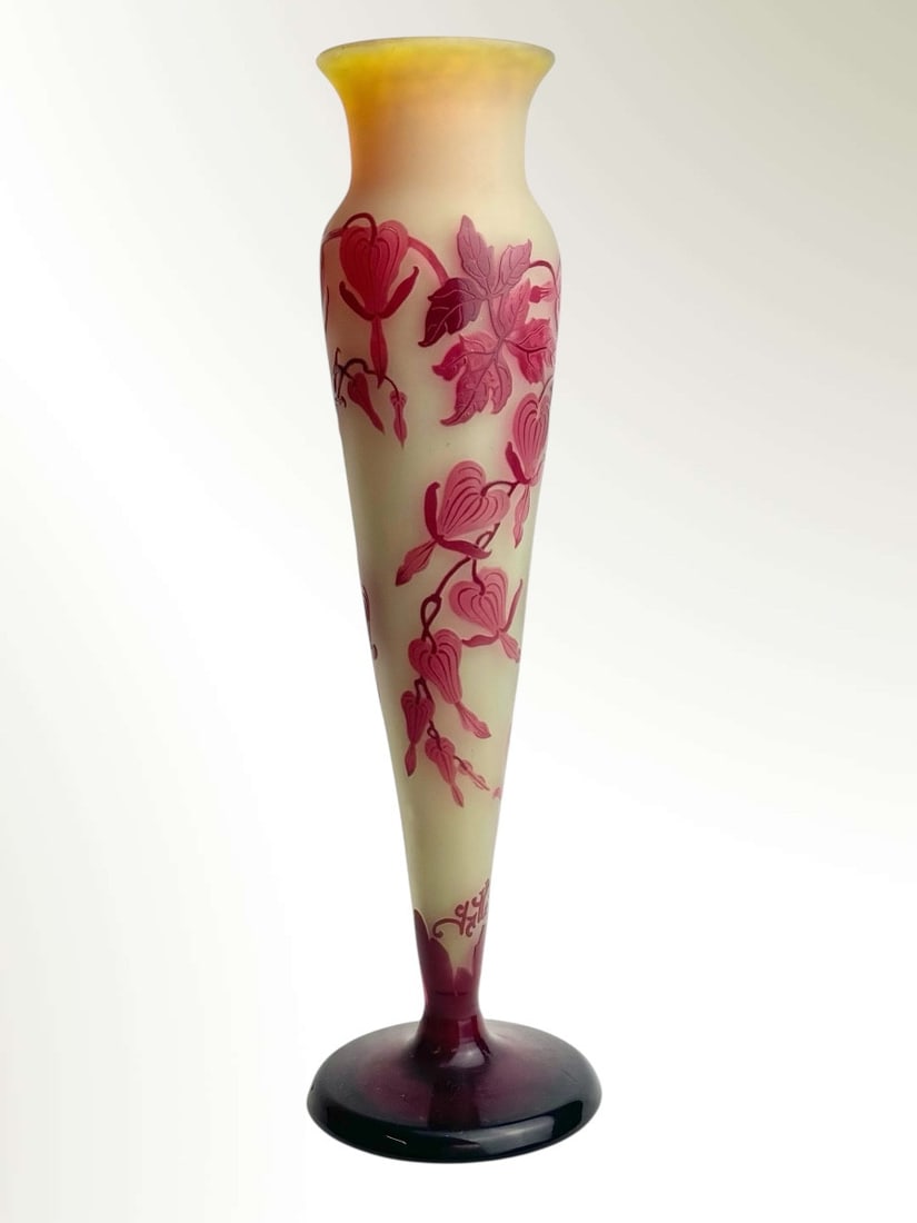 Emile Gallé Vase “Bleeding Hearts”: Multi-layered glass vase with deeply acid-etched decoration of flowering branches of intense red bleeding hearts on an opaque orange-yellow background. Signed Gallé within the decoration. Height: 32