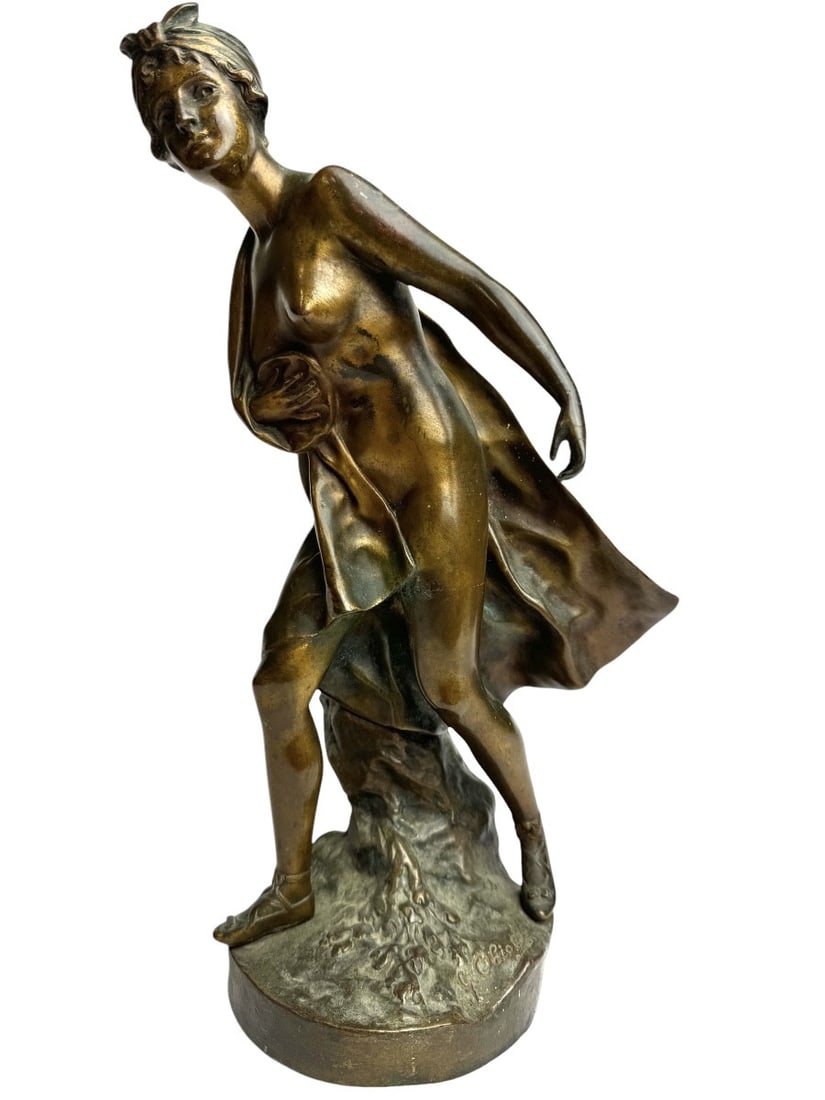 Gustavo Obiols Bronze Figure, Nude Woman: Bronze sculpture with nuanced brown patina depicting a nude woman wearing a cape. Early cast signed G. Obiols, late 19th century.Gustavo Obiols trained at the Barcelona School of Fine Arts and continu