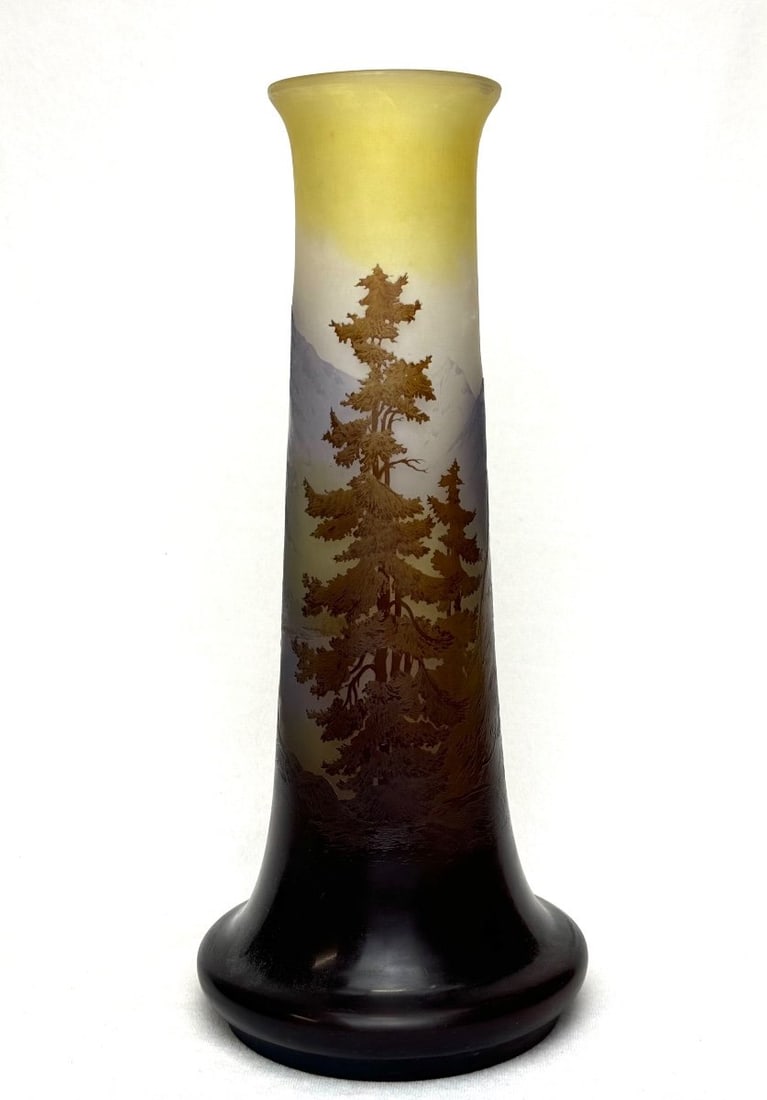 19th century Gallé Vase "The Blue Line of the Vosges": Elephant's foot shaped vase in multi-layered glass, finely cameo-engraved with mountain and fir tree landscapes reflected in a lake, in shades of blue, brown, and ochre on a nuanced opalescent yellow