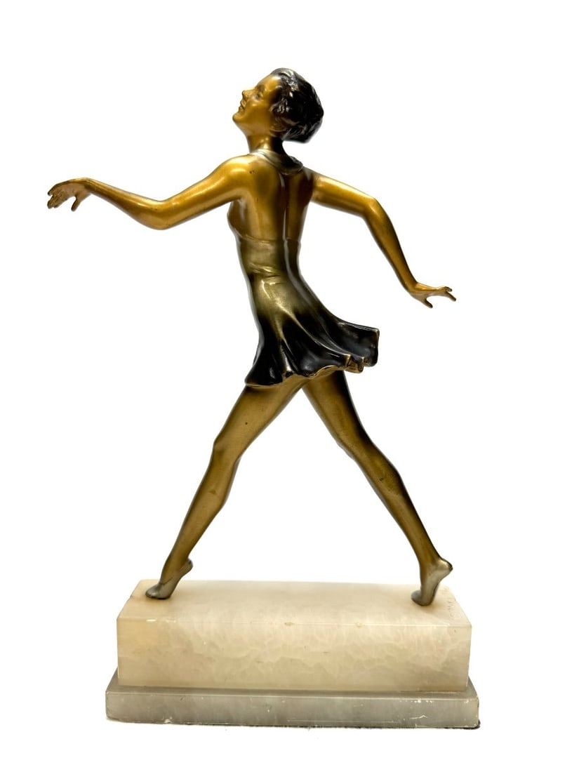 Lorenzl - Art Deco Bronze Sculpture of a Dancer: Art Deco bronze sculpture with a double patina, cold-painted, gilded and silvered, depicting a woman in a dance step, resting on an onyx base, circa 1925. Signed Lorenzl. In very good condition, minor