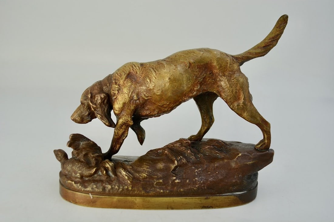 Prosper Lecourtier, Patinated Bronze Spaniel Sculpture, Signed.: Prosper Lecourtier 1851-1924 Spaniel on point in front of a duck.Bronze with a medal patina. Signed.Length: 20 cmWidth: 7.8 cmWeight: 1734 gGood condition / traces of wear to the patina