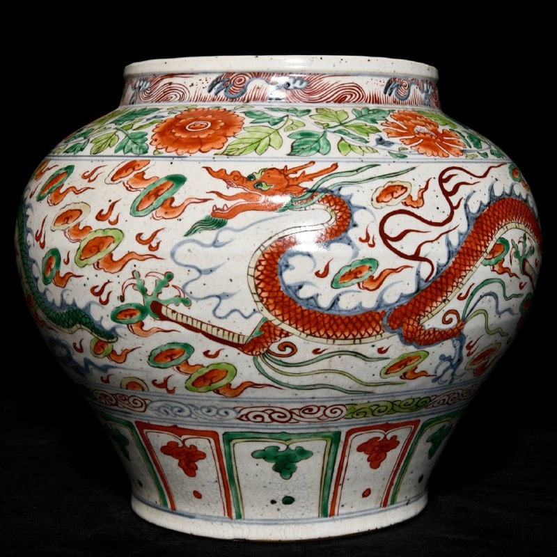 A Yuan dynasty blue-and-white porcelain jar with polychrome dragon design: A Yuan dynasty blue-and-white porcelain jar with polychrome dragon design, 29.5 cm high and 34.5 cm in diameter.