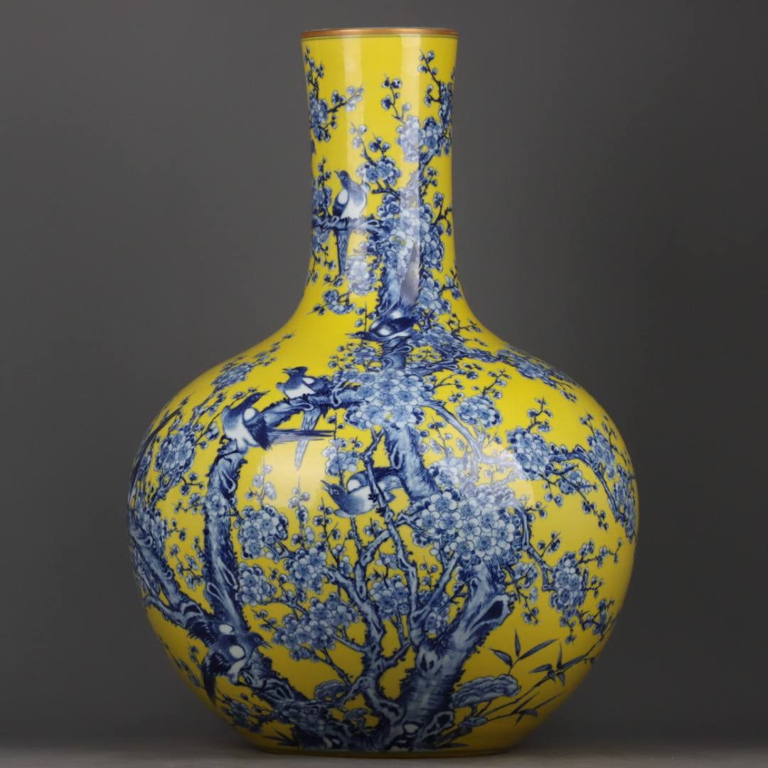 A Qing Dynasty Qianlong Period Blue and White Porcelain Vase with Yellow Glaze and Twelve Auspicious: A Qing Dynasty Qianlong Period Blue and White Porcelain Vase with Yellow Glaze and Twelve Auspicious Symbols (Height x Width: 58 x 40 cm)