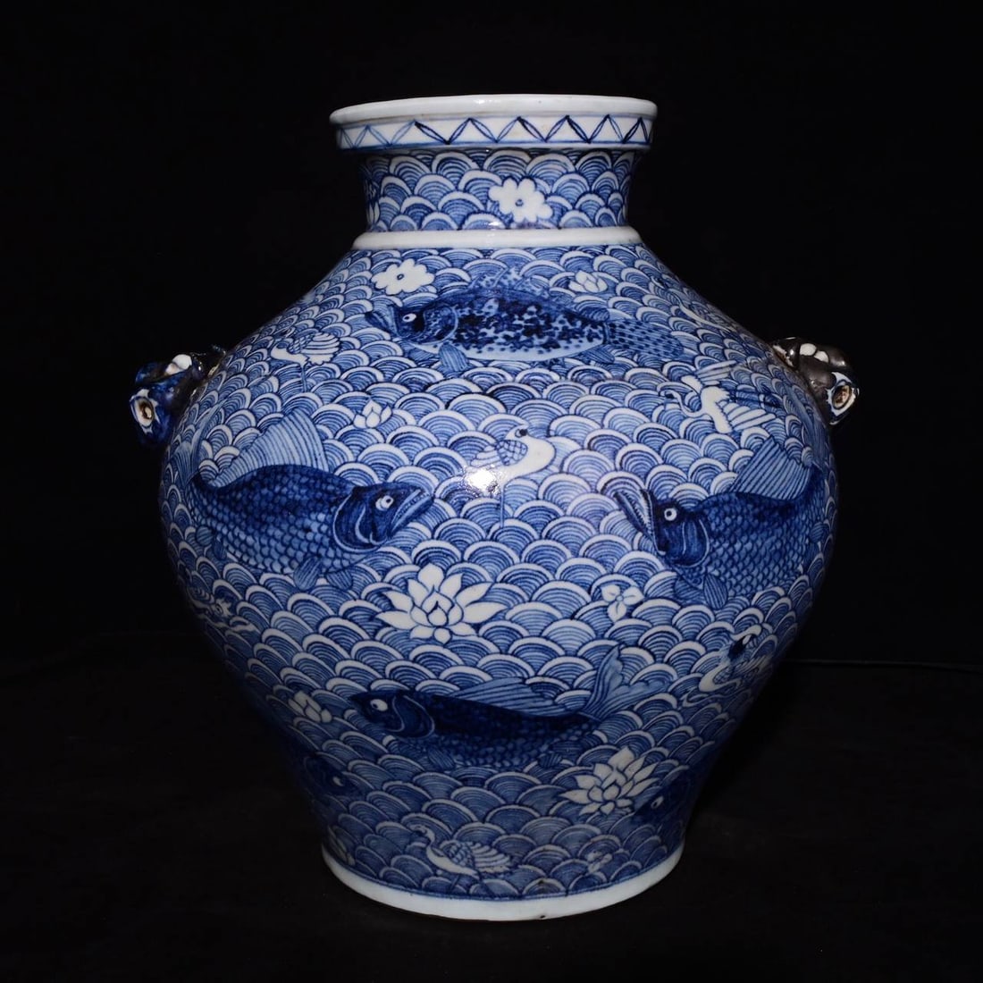 Yuan blue-and-white porcelain jars with a design of fish and waves and animal heads: Yuan blue-and-white porcelain jars with a design of fish and waves and animal heads, measuring 37.5 x 34 cm in height.