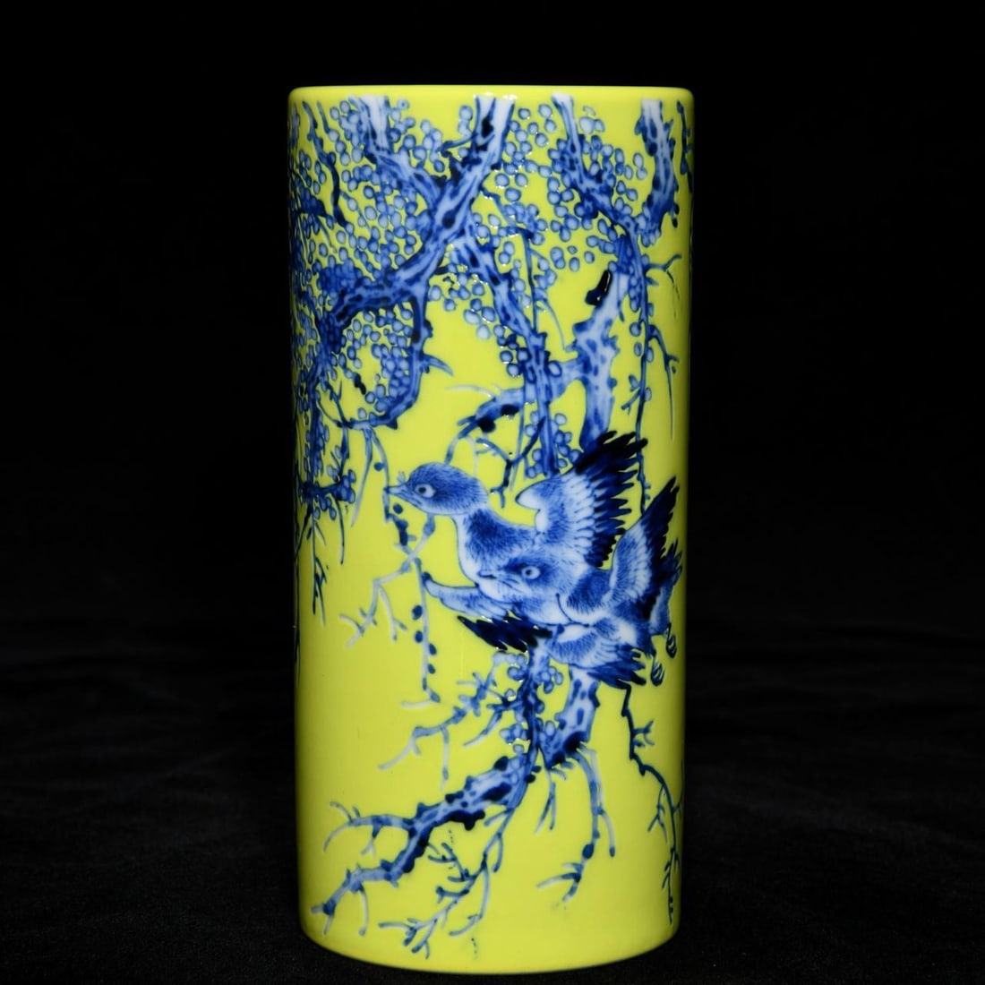 A Republic-era Wang Bu lemon-yellow ground blue-and-white floral and bird pattern brush pot: A Republic-era Wang Bu lemon-yellow ground blue-and-white floral and bird pattern brush pot, 14.3cm high and 6.8cm in diameter.