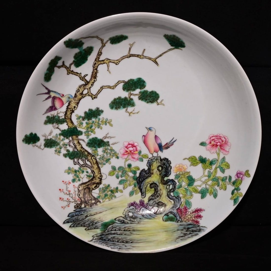 A famille rose floral and bird design plate with the mark of Emperor Yongzheng: A famille rose floral and bird design plate with the mark of Emperor Yongzheng of the Qing Dynasty, 4.6 x 21 cm in height.