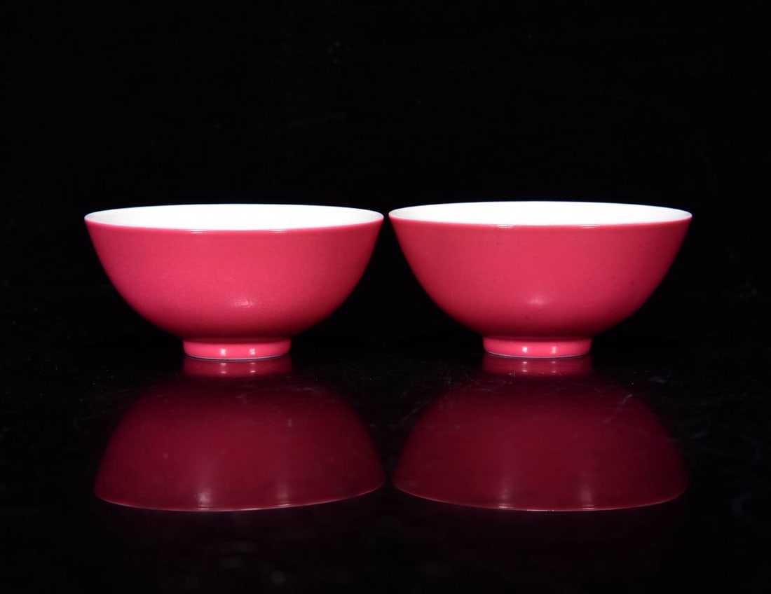 A small bowl with rouge-red famille rose enamels depicting arhats, dating to the Yongzheng period: A small bowl with rouge-red famille rose enamels depicting arhats, dating to the Yongzheng period of the Qing dynasty, measuring 3.5 x 8 cm.