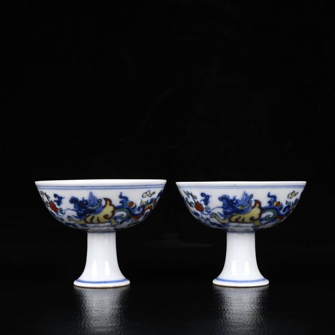 A Ming Dynasty Chenghua period doucai phoenix-patterned stemmed cups: A Ming Dynasty Chenghua period doucai phoenix-patterned stemmed cups measuring 6.5 x 8 cm.