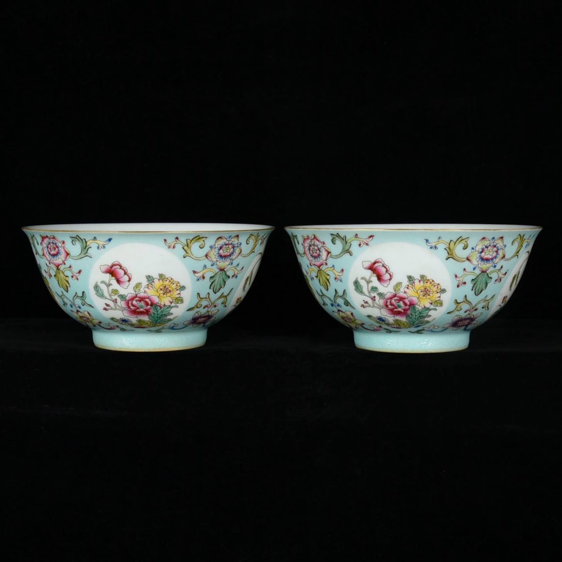 A Qing Dynasty Qianlong period green-ground famille rose enamel bowl with a design: A Qing Dynasty Qianlong period green-ground famille rose enamel bowl with a design of seasonal flowers and other floral motifs. Height: 7.6cm; Diameter: 16.2cm.