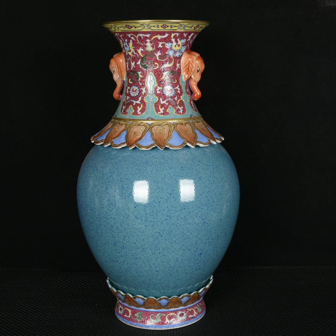 A three-section revolving vase with Jun-style glaze, enamel decoration, and gilt decoration: A three-section revolving vase with Jun-style glaze, enamel decoration, and gilt decoration, featuring elephant-ear handles, dating to the Qianlong period of the Qing dynasty. Height: 43 cm; Diameter: