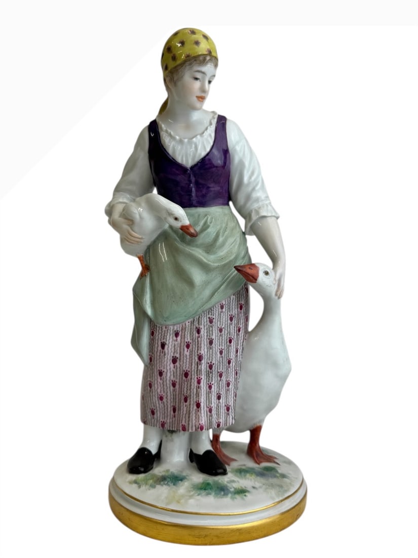 Jakob Ungerer for Meissen - Porcelain figure, The Goose Girl: A porcelain figurine depicting a peasant woman, known as The Goose Girl (Gänsemagd). This model was created by Ungerer and included in the Meissen catalogue in 1902. It bears the blue crossed swords