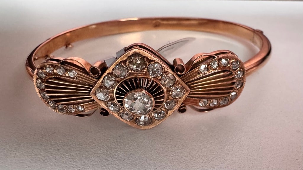 Russian Empire Tsarist gold bracelet with diamonds: Gold bracelet with a value of 56th standard, decorated with 1 large natural diamond and 32 small diamonds (antique cut; ~ 0.55 carats, G- HI \\ SI). 32 diamonds (antique cut; TW ~ 1.4 carats, G - ligh