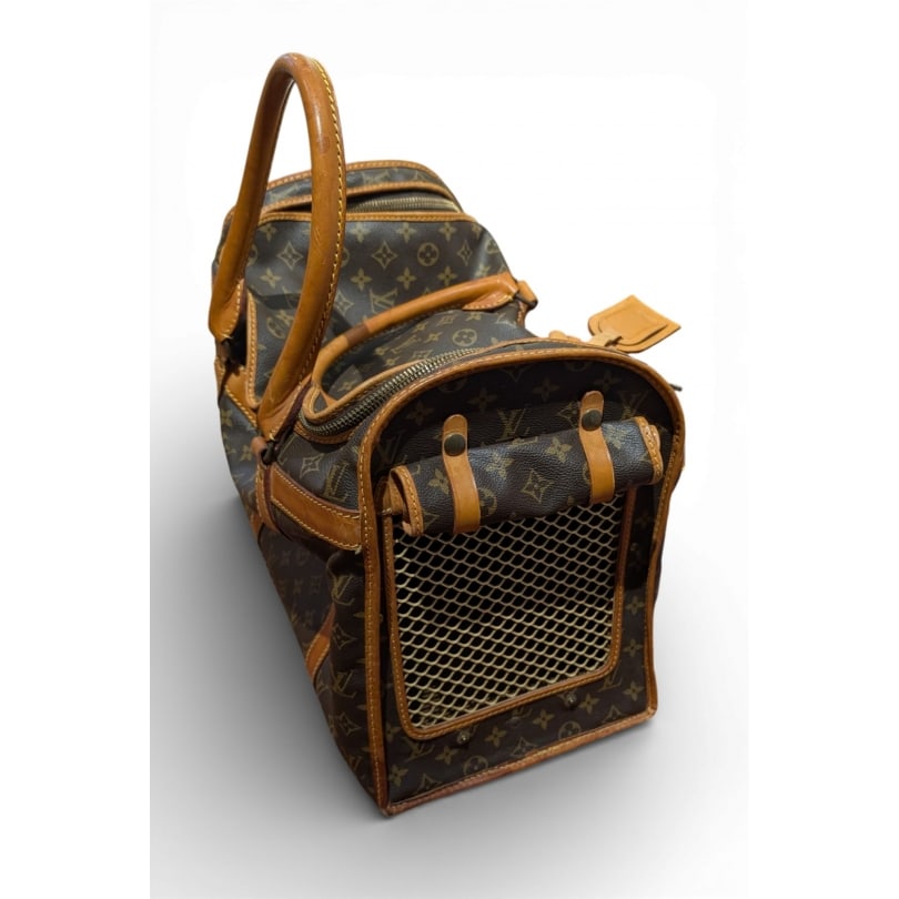 Vintage 20th century Louis Vuitton dog bag: Louis Vuitton monogrammed canvas and leather dog bag, numbered 844Origin: FrancePeriod: 20th centuryMaterials: LeatherDimensions: Ht 34 x 46 x 24 cm