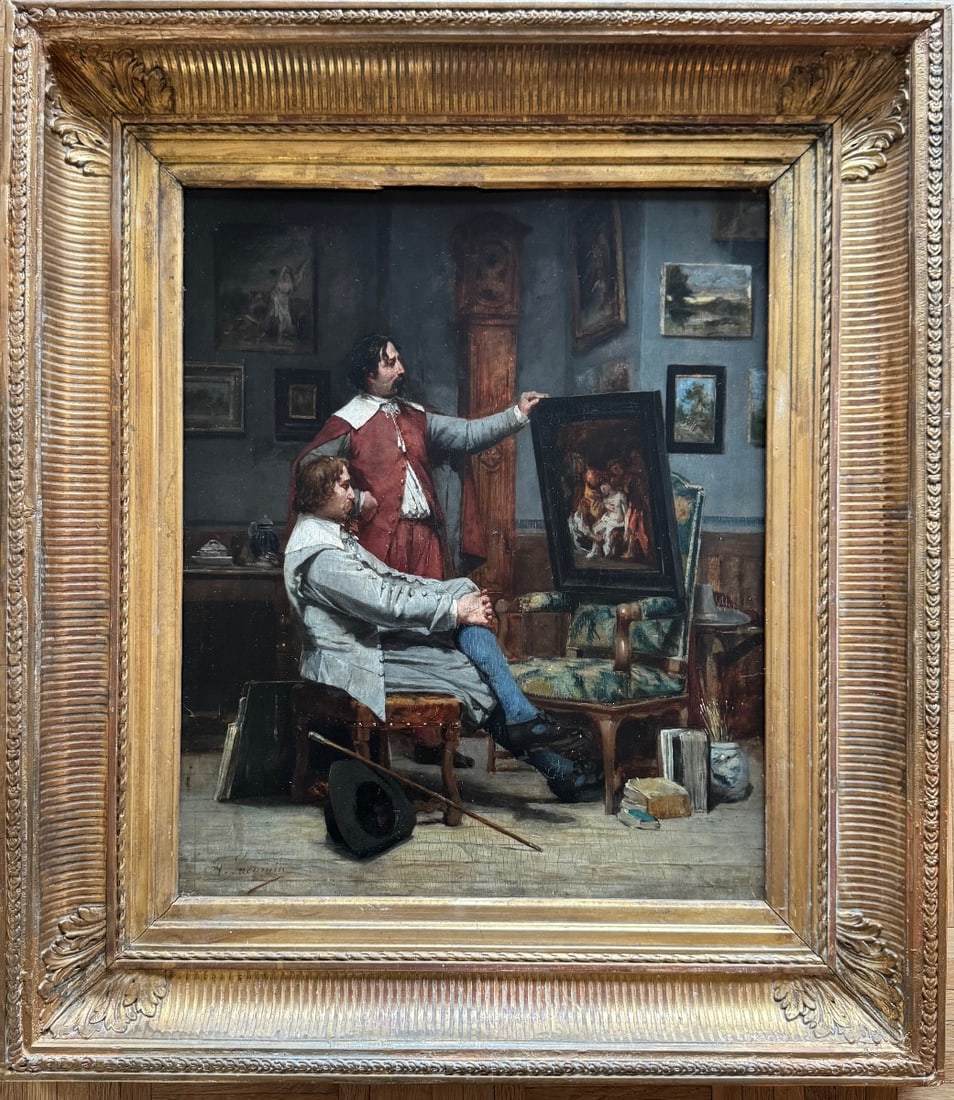 ALFRED LOUIS JACOMIN - THE PAINTER'S STUDIO: Alfred Louis Jacomin, oil on wood, a scene of a painter's studio showing a painting to a buyer. The scene is richly detailed. Signed lower left, framed (the frame has been restored and has minor losse