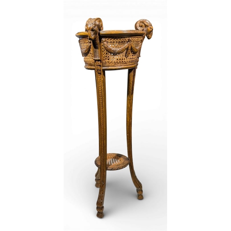 French 19th century Round planter with ram's heads: Round planter with ram's heads, caned, resting on three feetOrigin: FrancePeriod: 19th centuryMaterials: Carved woodDimensions: Height 99 cm x Diameter 40 cm