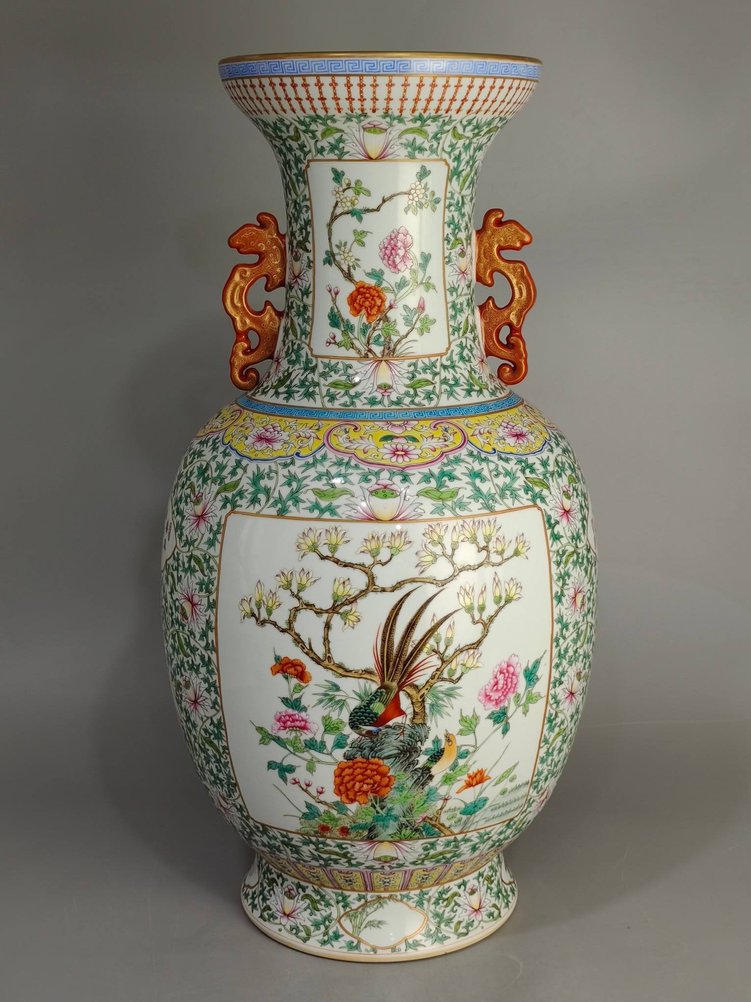 A Qing Dynasty Qianlong period famille rose vase with a lotus scroll design and a five-nut motif: A Qing Dynasty Qianlong period famille rose vase with a lotus scroll design and a five-nut motif, measuring 59 cm in height and 30 cm in diameter.
