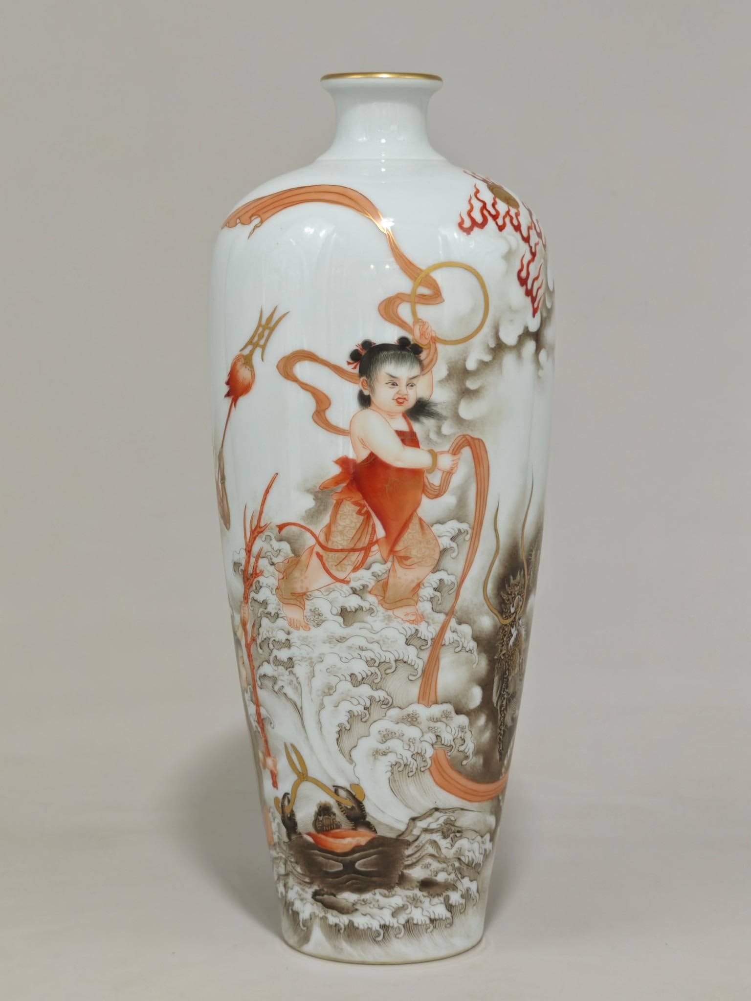 A Qing Dynasty Yongzheng period (1726-1768) painted plum vase with Nezha making waves: A Qing Dynasty Yongzheng period (1726-1768) painted plum vase with Nezha making waves in the sea design, measuring 26 cm in height and 11 cm in diameter.
