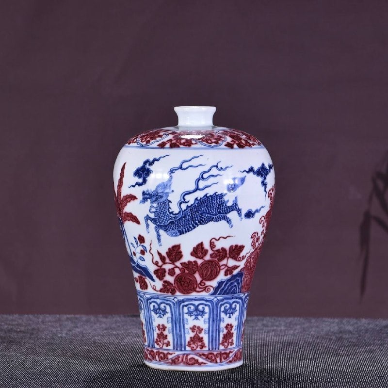 A Ming Hongwu period blue-and-white underglaze red meiping vase with a qilin design (1 of 7)
