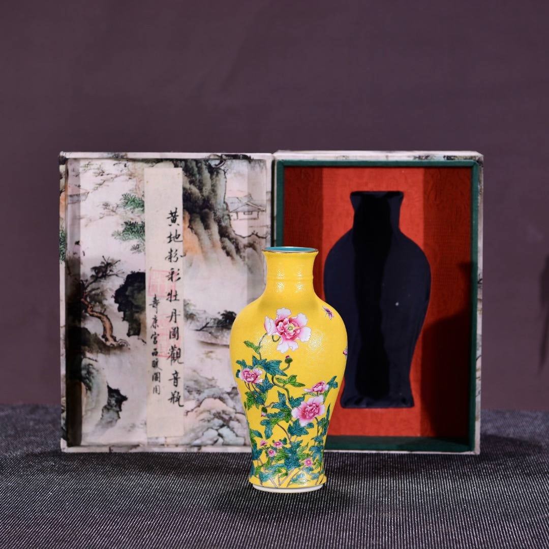 A Qing Dynasty Yongzheng period (1720-1725) yellow-ground famille rose Guanyin vase with peony desig: A Qing Dynasty Yongzheng period (1720-1725) yellow-ground famille rose Guanyin vase with peony design,Dimensions: Height 25 cm, Width 12 cm