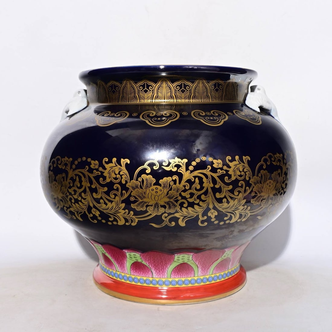 A Qing Dynasty Qianlong period sacrificial blue glaze gilt floral swallow-shaped jar: A Qing Dynasty Qianlong period sacrificial blue glaze gilt floral swallow-shaped jar, 31 x 35 cm in height.