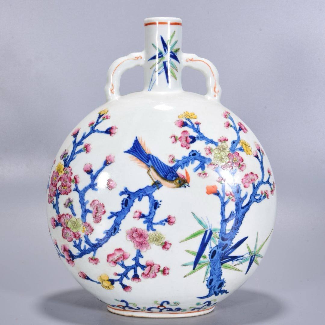 A flat vase with magpies depicting plum blossoms, dating from the Qianlong period of the Qing Dynast: A flat vase with magpies depicting plum blossoms, dating from the Qianlong period of the Qing Dynasty, measuring 28*21 cm.
