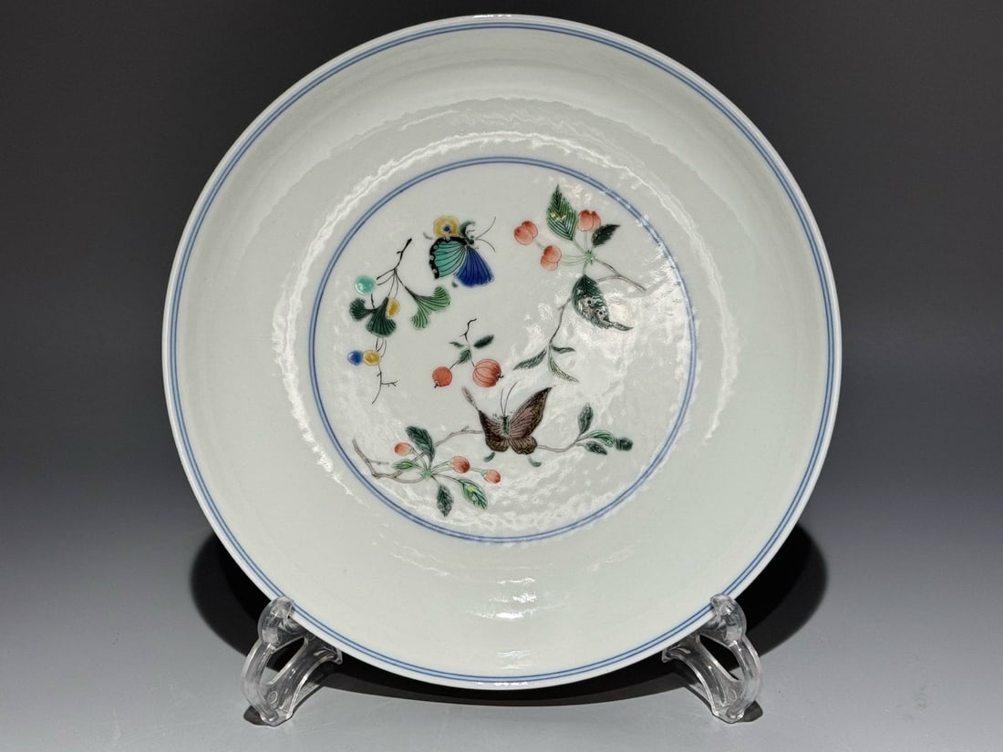 A polychrome dish with butterfly and floral design and three auspicious motifs (1 of 7)