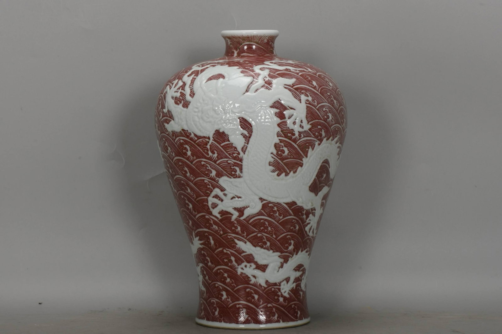 A Qing Dynasty Yongzheng period underglaze red plum vase (1 of 7)