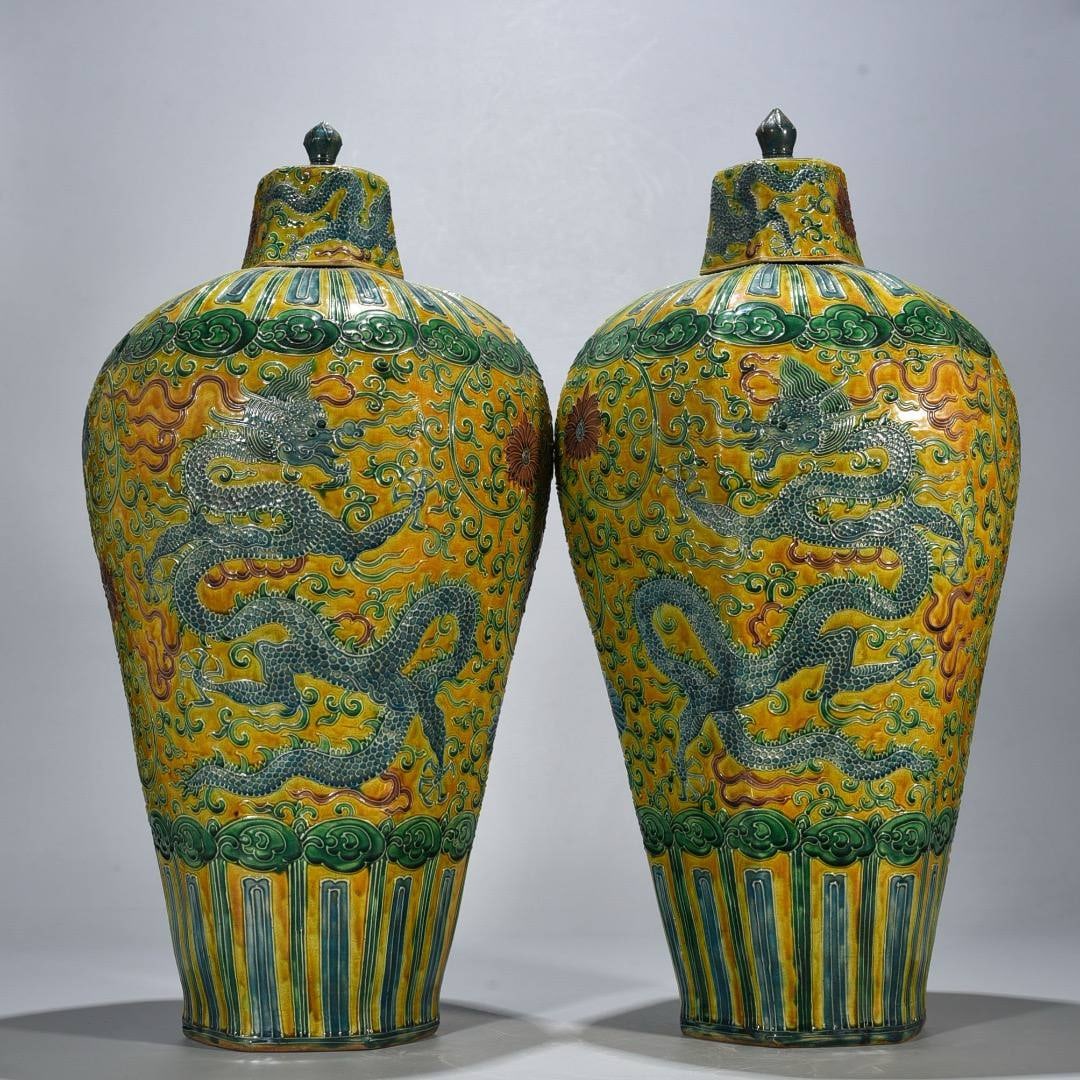 Ming Jiajing period yellow-ground enamel-painted octagonal plum vase with dragon scroll design: Ming Jiajing period yellow-ground enamel-painted octagonal plum vase with dragon scroll design, 55*21 cm.