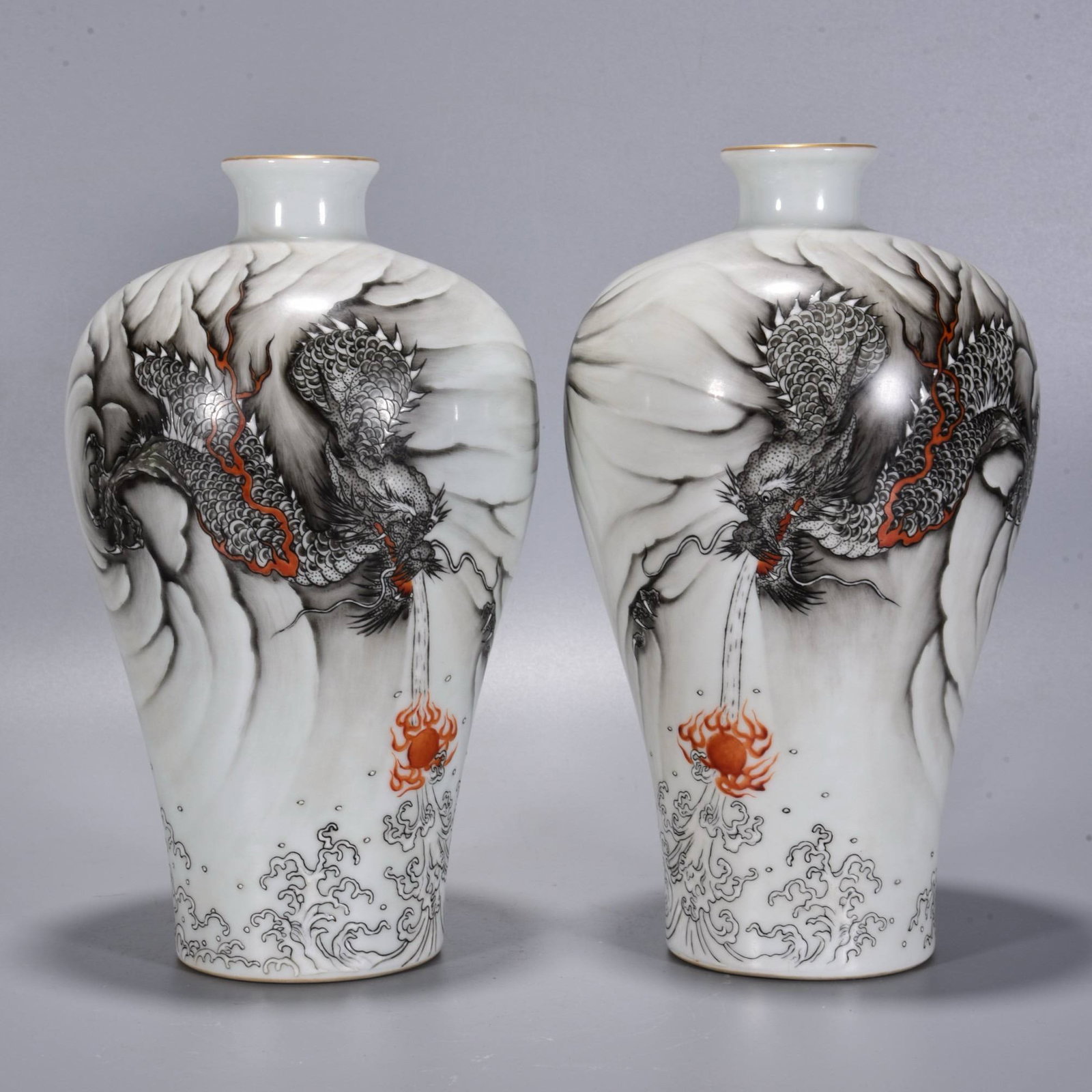 A Qing Dynasty Yongzheng period ink-painted plum vases with dragon and cloud design: A Qing Dynasty Yongzheng period ink-painted plum vase with dragon and cloud design, 24 x 14 cm.