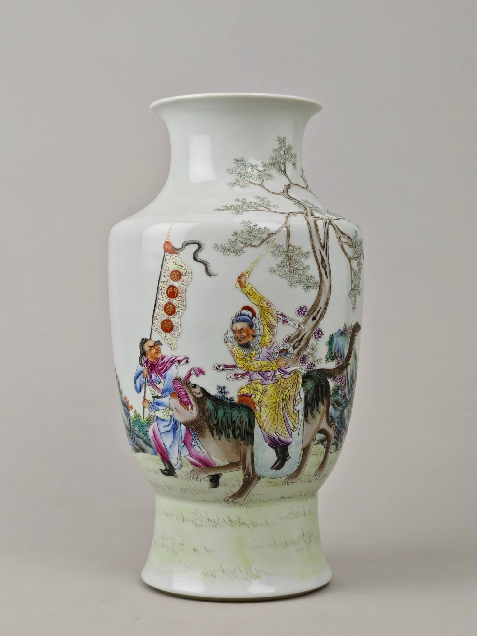 A famille rose lantern vase with a figure of the God of Wealth descending: A famille rose lantern vase with a figure of the God of Wealth descending, bearing the mark of the Qianlong period of the Qing Dynasty. Height: 26 cm, Diameter: 14 cm.