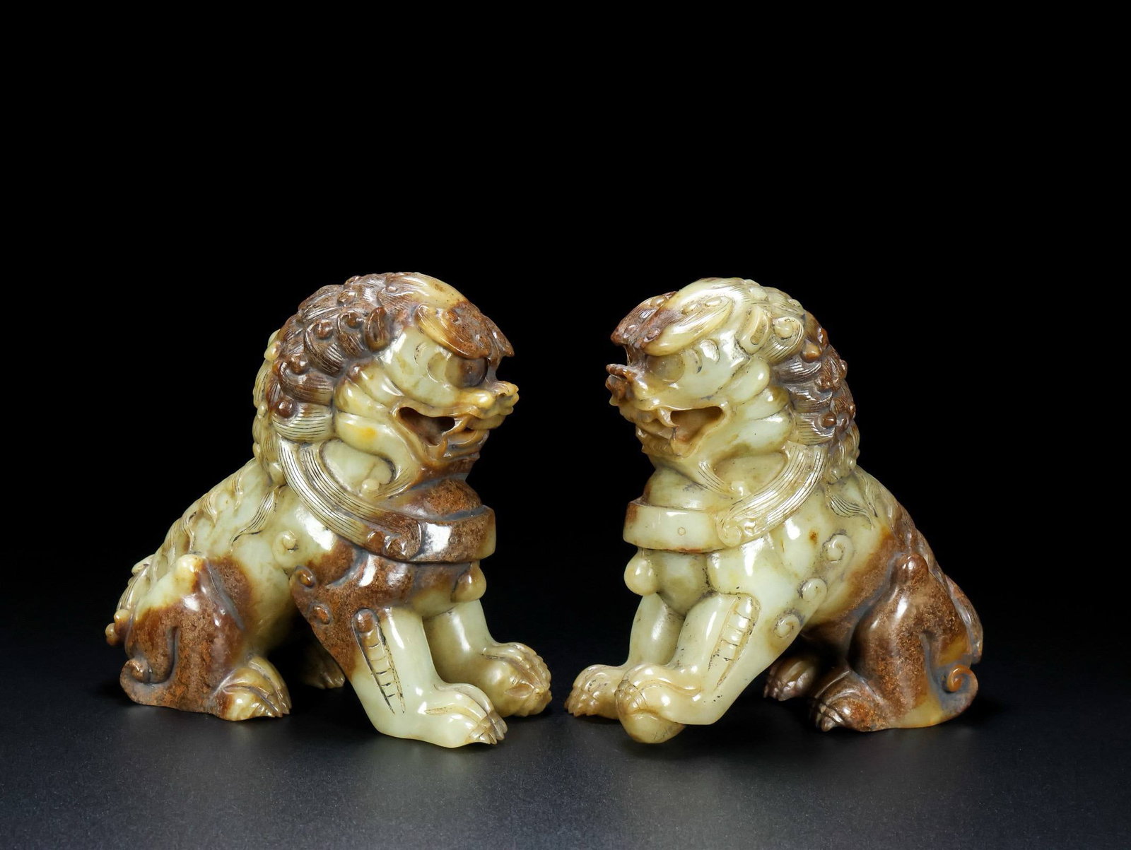 pair of Hetian jade lions,: This pair of Hetian jade lions, formerly part of a collection, . Dimensions: Length 13 cm, Width 6.5 cm, Height 13 cm; Weight: 2556 grams;