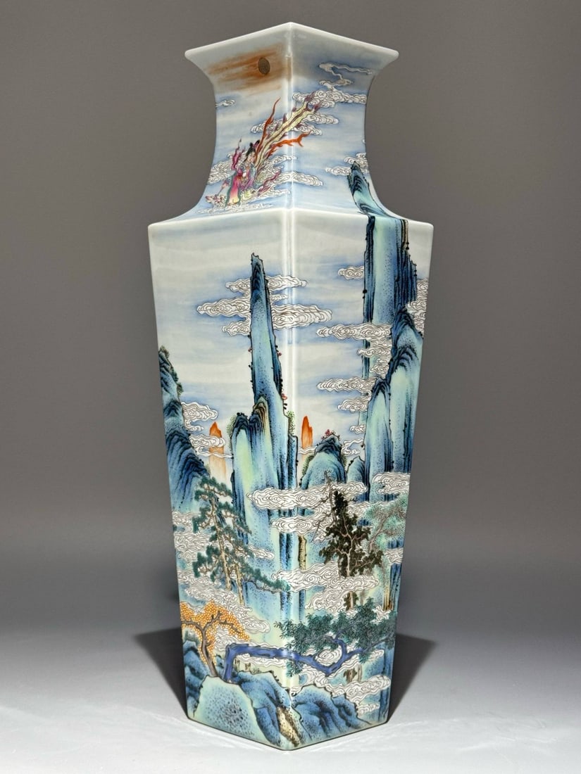 A square vase with a landscape and fairy-themed design, bearing the mark of the Qianlong period: A square vase with a landscape and fairy-themed design, bearing the mark of the Qianlong period (1736-1745). Height: 35cm; Width: 11.3cm.