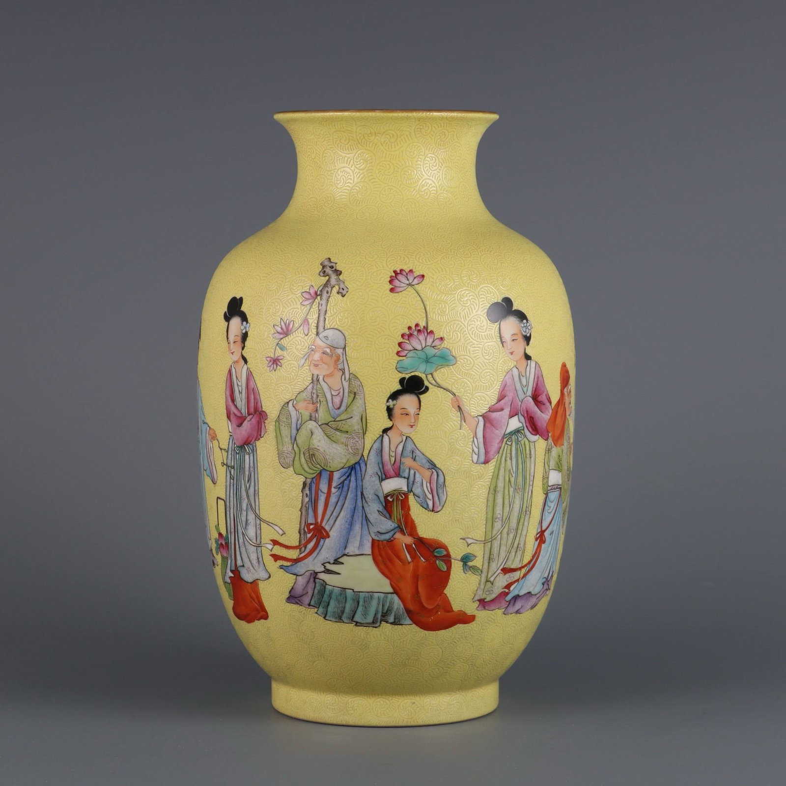 A Qing Dynasty Daoguang period (1820-1865) yellow-ground famille rose vase: A Qing Dynasty Daoguang period (1820-1865) yellow-ground famille rose vase with twelve floral designs. Dimensions: Height 23.2 cm, Mouth Diameter 8.5 cm.