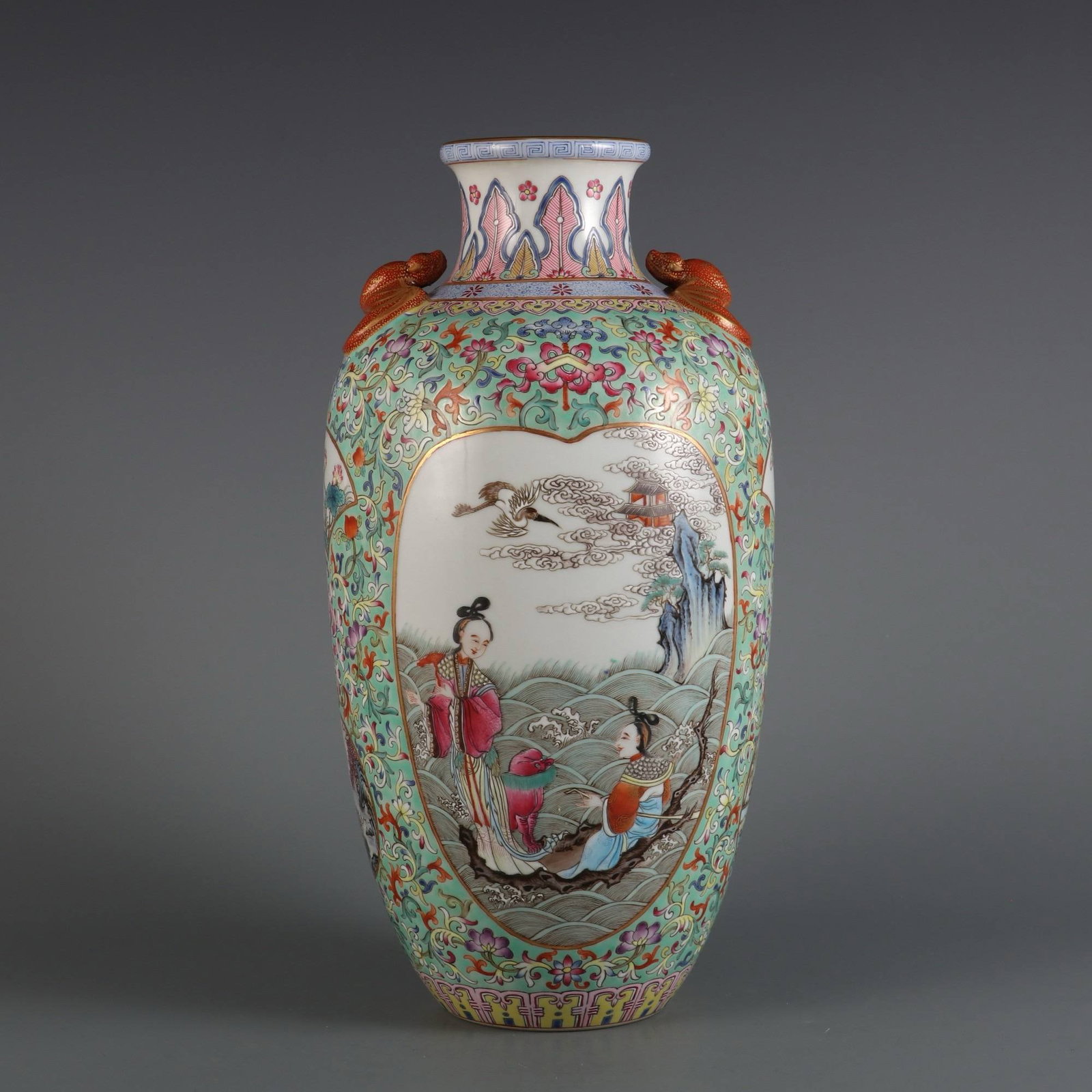 A Qing Dynasty Qianlong period (1736-1745): A Qing Dynasty Qianlong period (1736-1745) green-ground famille rose vase with openwork landscape and longevity design. Dimensions: Height 32 cm, Belly diameter 15 cm, Mouth diameter 7.5 cm.
