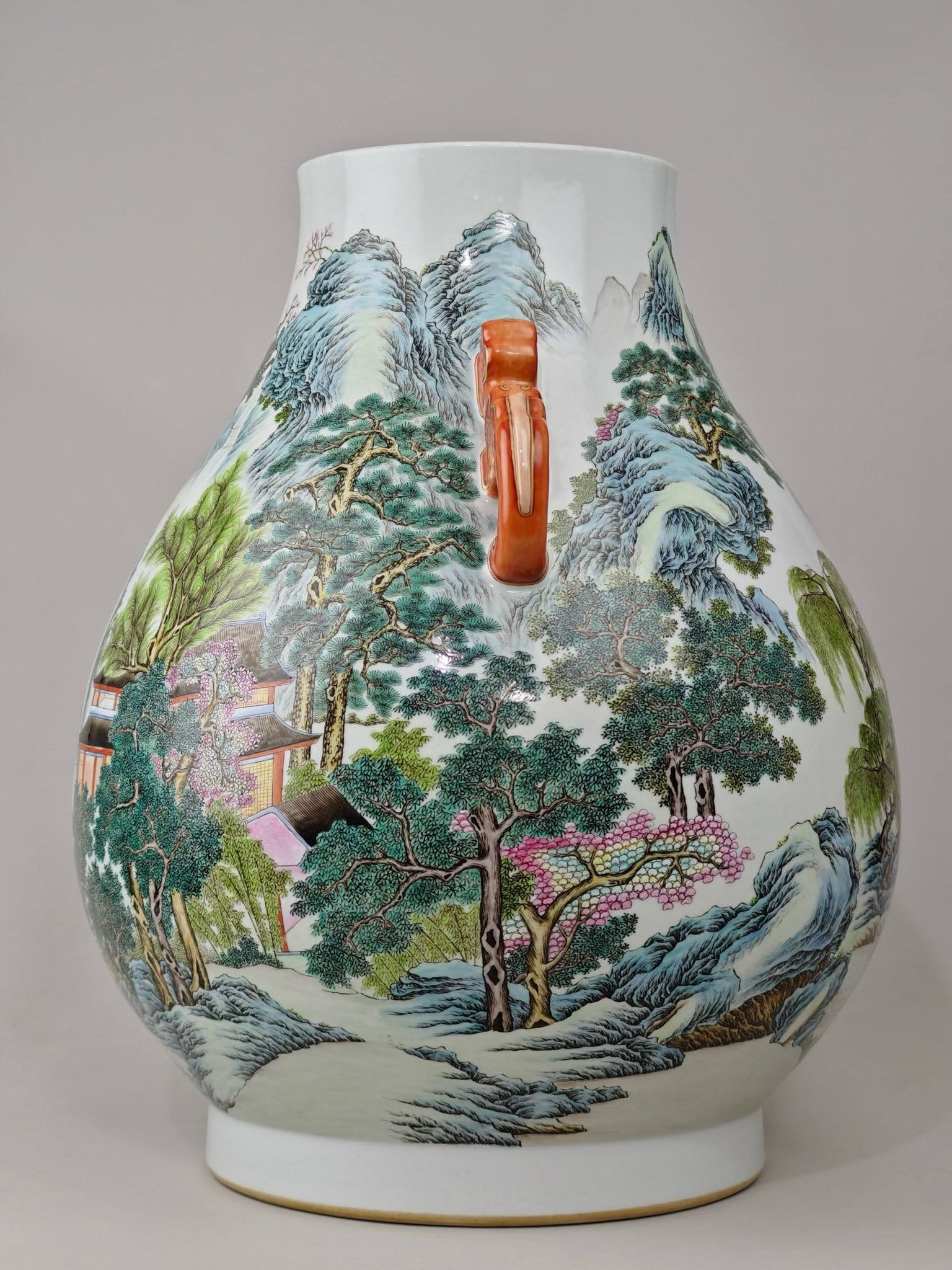 This famille rose landscape double-eared vase: This famille rose landscape double-eared vase, bearing the mark of the Qianlong period of the Qing Dynasty, measures 45.5 cm in height and 38 cm in diameter.