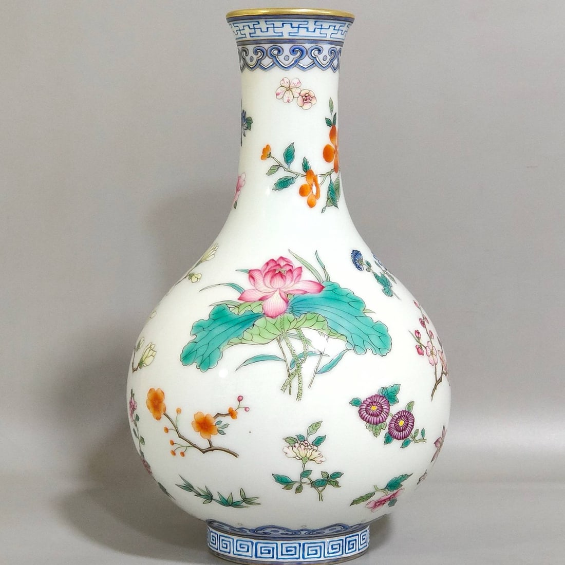 A Qing Dynasty Qianlong period jade pot: A Qing Dynasty Qianlong period jade pot with butterfly and flower design, 19.3 cm high and 11.5 cm in diameter.