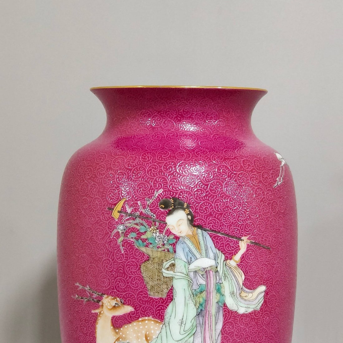 A Qing Dynasty Qianlong period rouge-red vase: A Qing Dynasty Qianlong period rouge-red vase with a design of mushrooms and winter melons, measuring 19 cm in height and 12 cm in diameter.