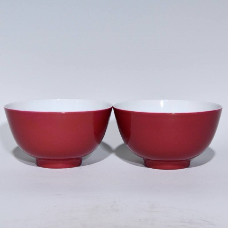 A Qing Dynasty, Yongzheng period, rouge-red famille rose bowls: A Qing Dynasty, Yongzheng period, rouge-red famille rose bowl with peach design, 6cm high and 10.8cm in diameter.