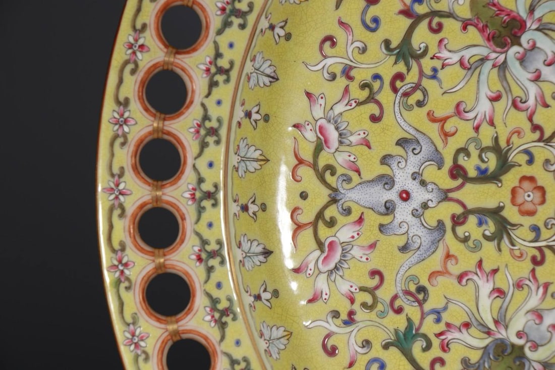 A Qing Dynasty Qianlong Period A glazed dish: A Qing Dynasty Qianlong Period A glazed dish with lotus and apple motifs, 6.7 cm high, 38 cm at the rim, and 24.5 cm at the base.